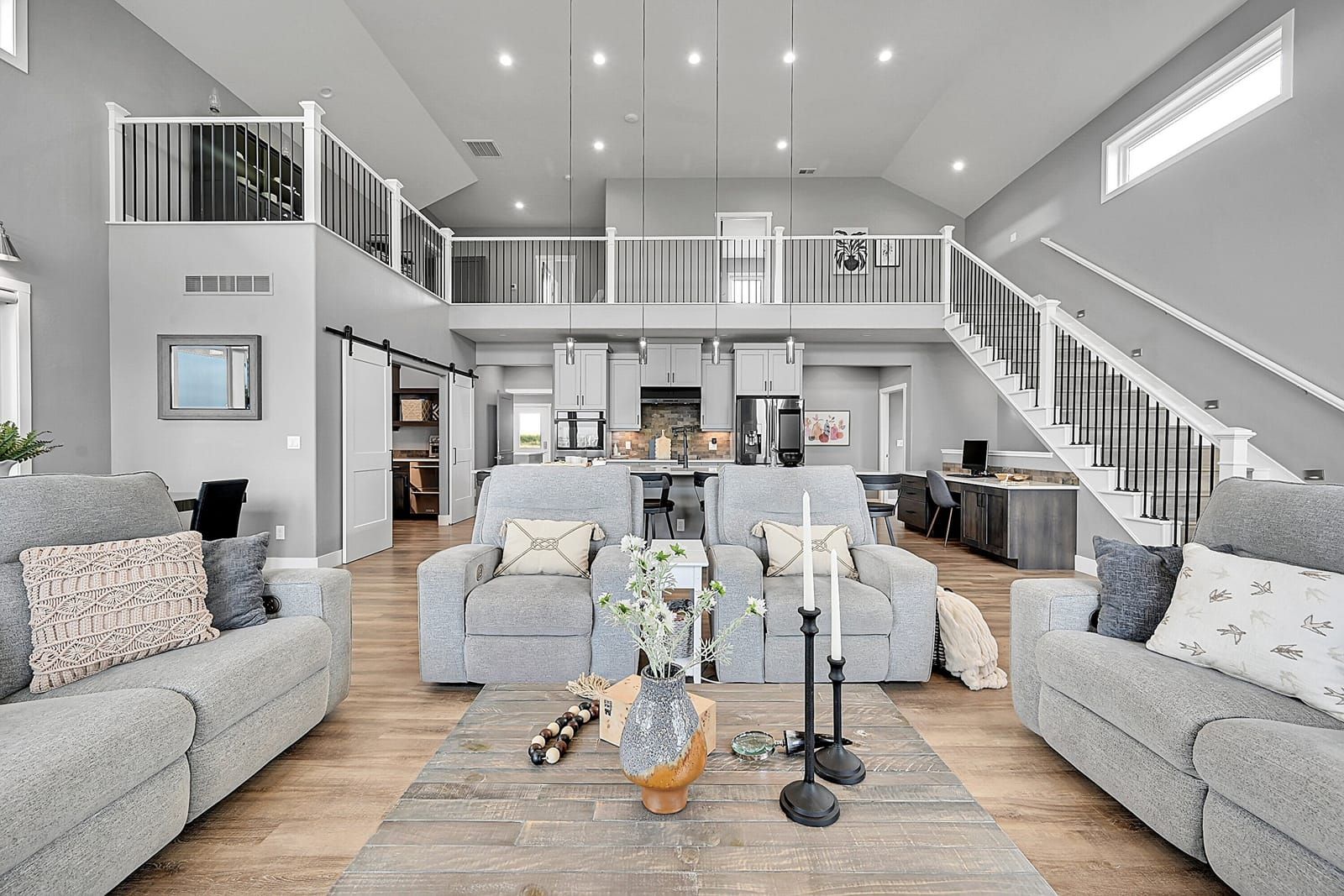 Living room with staircase in a Weld County home listed by Suzy